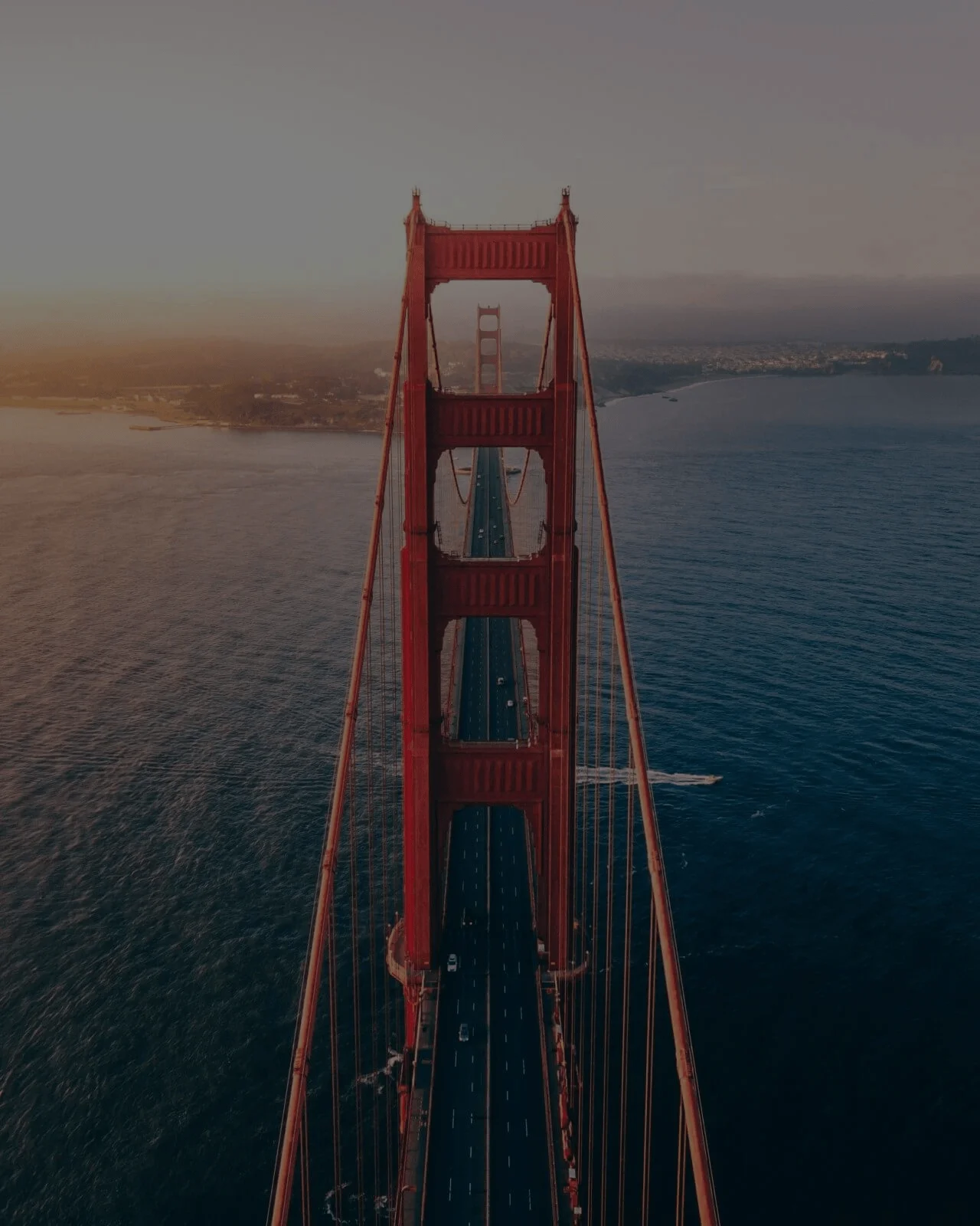 Golden Gate Bridge at sunset, aerial view.